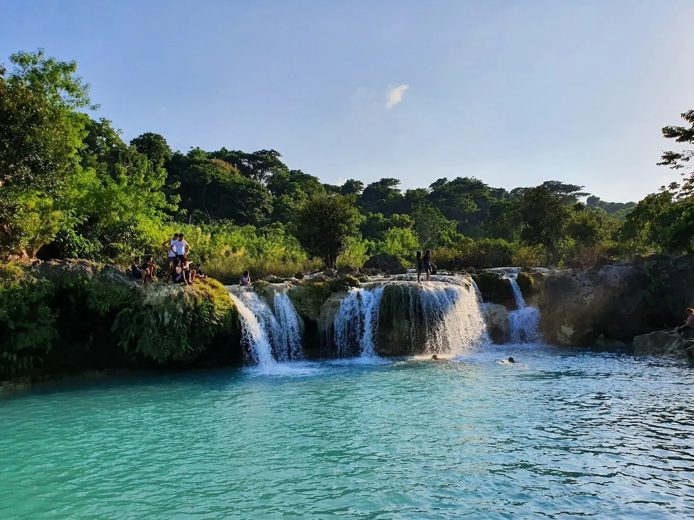 Bolinao Falls 3 with calm turquoise waters and tropical surroundings