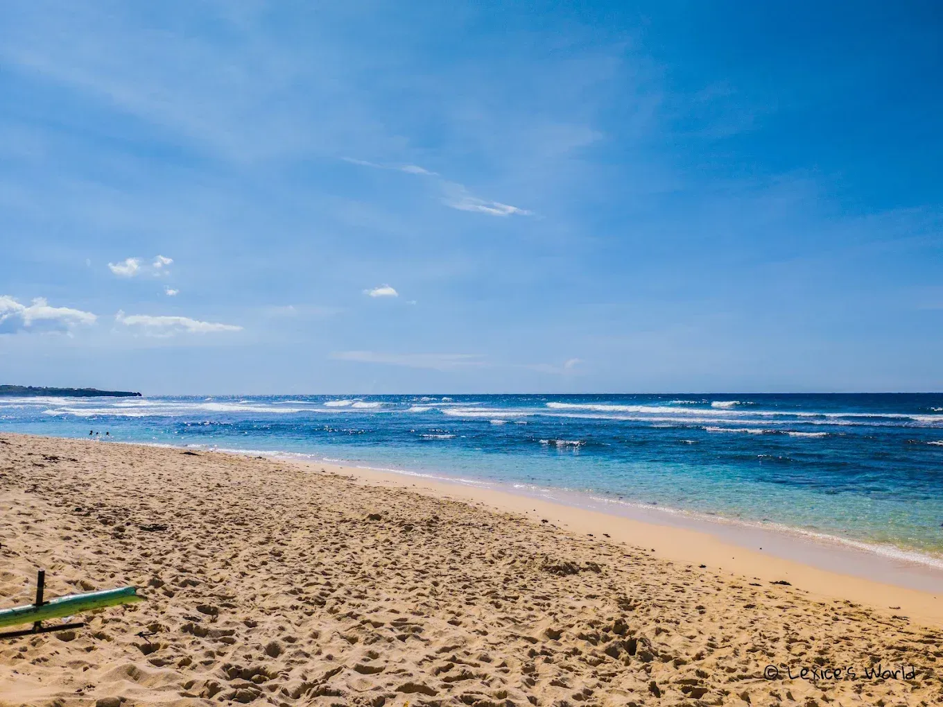 Patar Beach golden sand and clear waters at sunset
